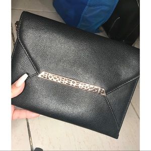 Stella & Dot black and gold wristlet.